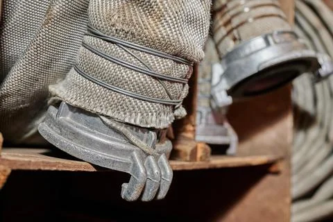 Strong professional fire hose in real life during firefighters training Stock Photos