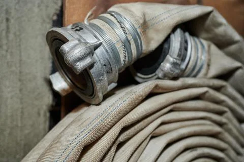 Strong professional fire hose in real life during firefighters training Stock Photos