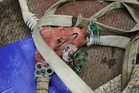 Strong professional fire hose in real life during firefighters training Stock Photos