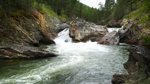 Strong River in Canada jumping off the Rocks and forming Rapids Stock Footage 279534973