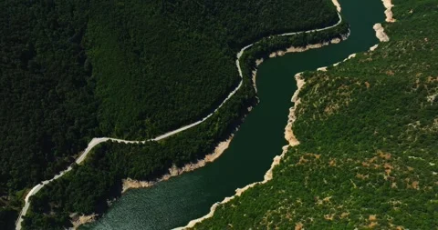 Strong River Current Wind Mountain Valley Road Aerial High Altitude Steady Stock Footage 289417320