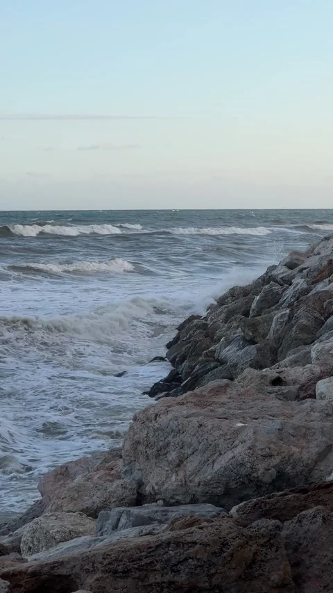 Strong sea waves crushing into rocks. View from pier. Vertical video Stock Footage 240921668