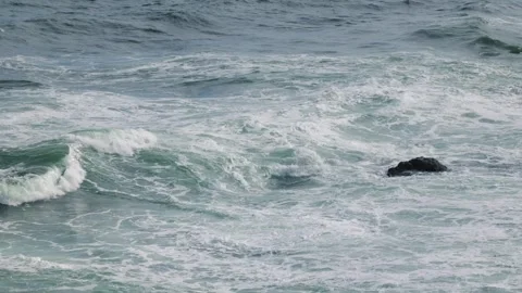 Strong sea waves hitting small rocks. Raging sea in storm Stock Footage 292122291