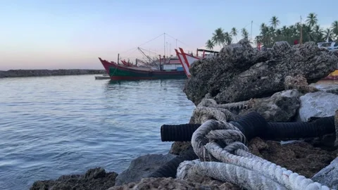 A strong ship rope to tide the ship on the rock Stock Footage 245889777