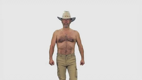 A strong smiling middle aged shirtless man walking in cowboy hat, alpha in Stock Footage 306025692
