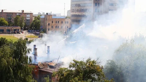 A strong smoke was thrown down after watering Stock Footage 80256857