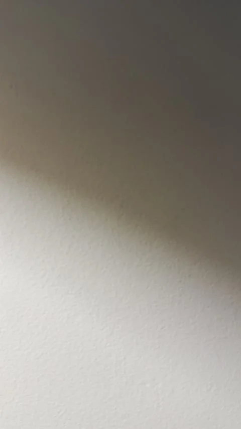 Strong to Soft Light Transition on Minimal White Wall Background Video stock 329906639