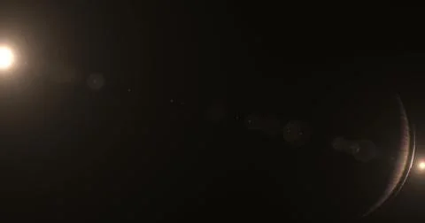 Strong splash of light exploding on the black background like in lens and Stock Photos