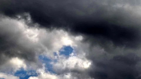 Strong storm clouds with short glimpses of clear skies. Time lapse in 4K. Stock Footage 88541781