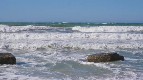 Strong storm waves beating against the breakwater on the waterfront, water sp 動画素材 132837748