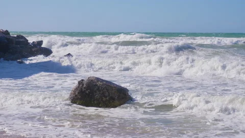 Strong storm waves beating against the breakwater on the waterfront, water sp 動画素材 141135610