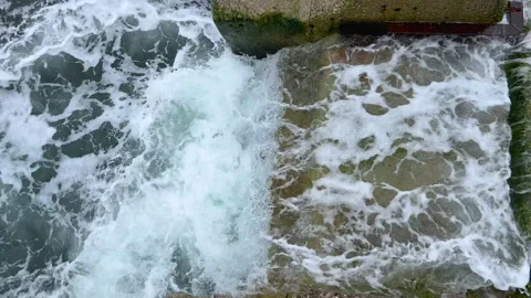 Strong storm waves beating against the stairs going into rough sea. Beautiful Stock Footage 237027987