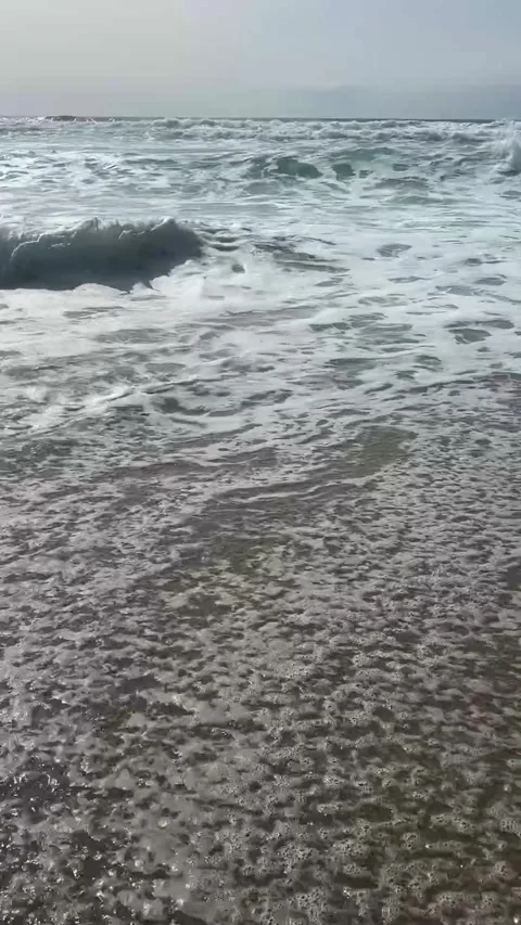 The strong stormy waves crashign on the beach at Sennen Cove, Cornwall. Stock Footage 322073640