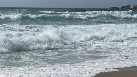 The strong stormy waves crashign on the beach at Sennen Cove, Cornwall. Stock Footage 322073665