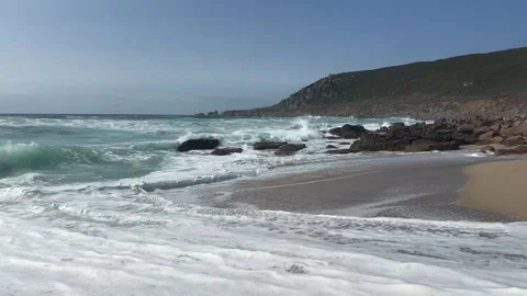 The strong stormy waves crashign on the beach at Sennen Cove, Cornwall. Stock Footage 322073676