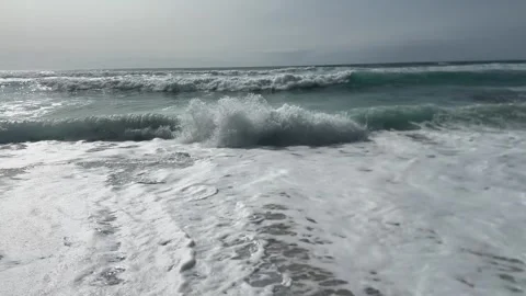 The strong stormy waves crashign on the beach at Sennen Cove, Cornwall. Stock Footage 322073705