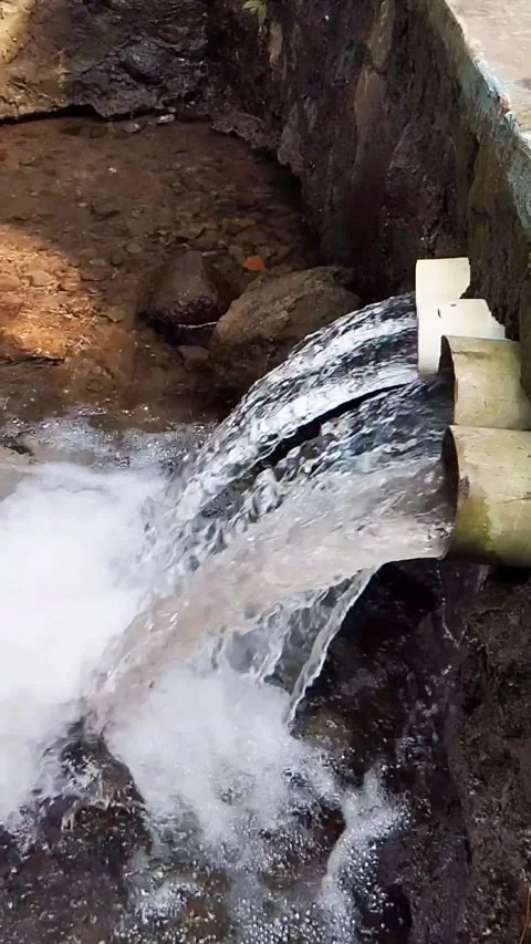 A Strong Stream Of Clear Water Gushed From Several PVC Drainage Pipes Stock Footage 339317458