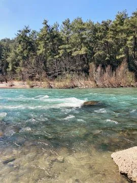 The strong stream of the mountain river comes down from the mountains crystal Stock Photos
