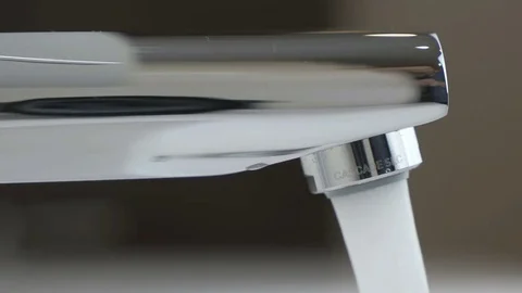 Strong stream of water flows from chrome faucet Stock Footage 72521166