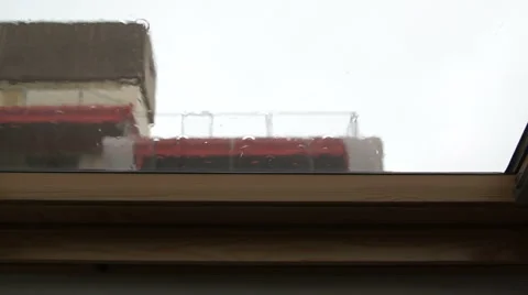 Strong summer rain taps at attic window Stock Footage 40825762