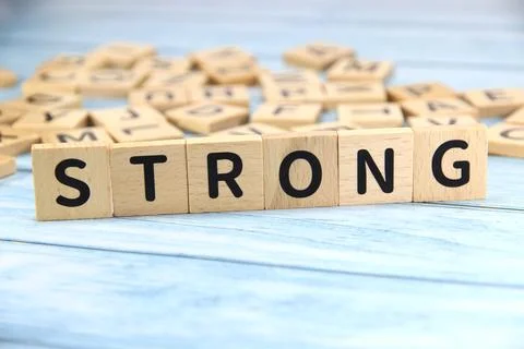 "STRONG" text or message short word english letter on wooden cubes block wi.. Stock Photos