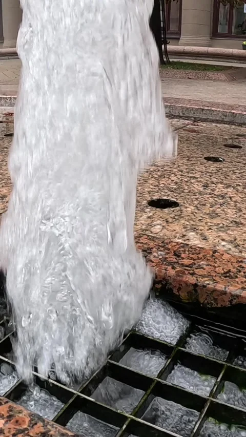 Strong vertical water jet streaming from ground fountain Video stock 321761399