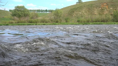 Strong water current over shallow stone bank at the river. Slow motion 240 fps Stock Footage 124734306
