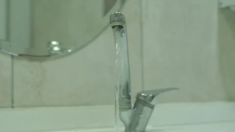 Strong-water-flow-chrome-faucet-bathroom-close-up Stock Footage 344800061