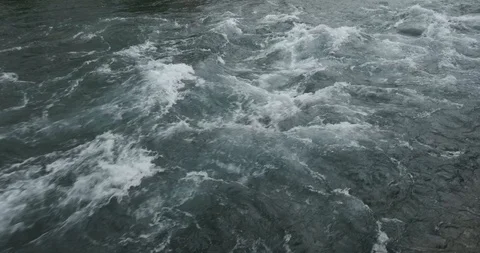 Strong water flow in a mountain river close-up Stock Footage 126142559