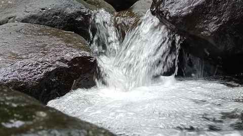 Strong Water Stream Flow Between Rocks | Natural River Energy Stock Footage 330562114
