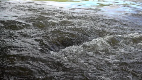 Strong water stream flows across the stones, close up, slow motion 240 fps Stock Footage 99503946