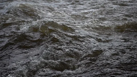 Strong water stream flows across the stones, close up. Slow motion 480 fps Video stock 124612368