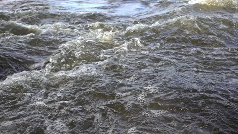 Strong water stream at the river rapids, closeup, slow motion 240 fps Video stock 99503564