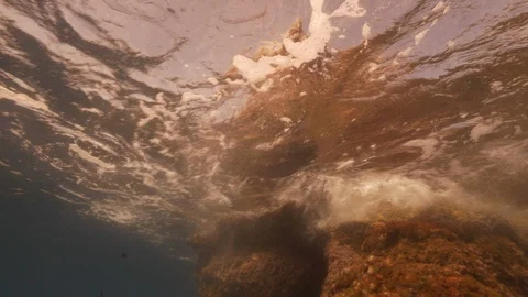 Strong waves against rocks framed from below, Mediterranean sea, Italy Stock Footage 112013678