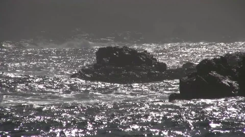 Strong waves breaking on rocks Stock Footage 92930490