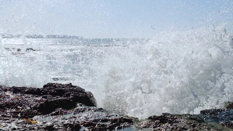 Strong waves crashing into rocks Stock Footage 129555562