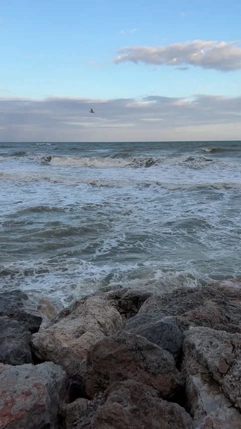 Strong waves crushing into rocks. Vertical video Stock Footage 240921698