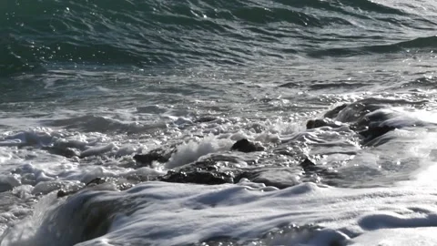 Strong waves of Ionical sea breaking and splashing against the shore Stock Footage 141127096