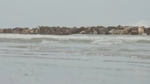 Strong waves at sea with a breakwater Stock Footage 288985808