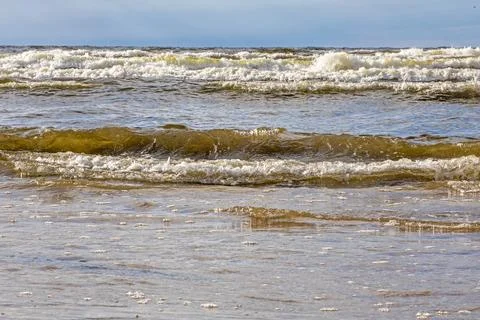 Strong waves on the seashore before the rain Stock Photos