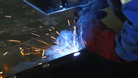 A strong welder worker are welding in the construction site in the factory. Stock Footage 142823740