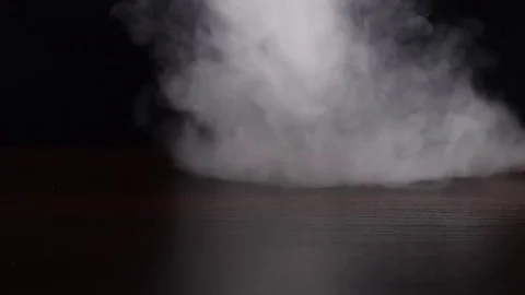 Strong white smoke on the black background slow motion Stock Footage 75794926