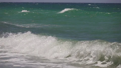 Strong wind blowing and waves on blue-green Mediterranean sea Stock Footage 131061315