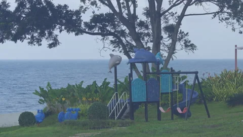 Strong wind blowing through empty playground on beach coast before storm approac Stock-Footage 340185673