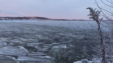 Strong wind breaks the ice on the lake Stock Footage 245343795