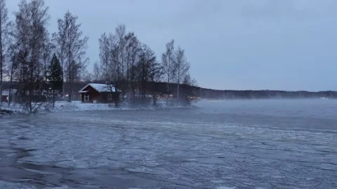 Strong wind breaks the ice on the lake Stock Footage 245343817