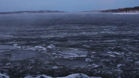Strong wind breaks the ice on the lake Stock Footage 245343839