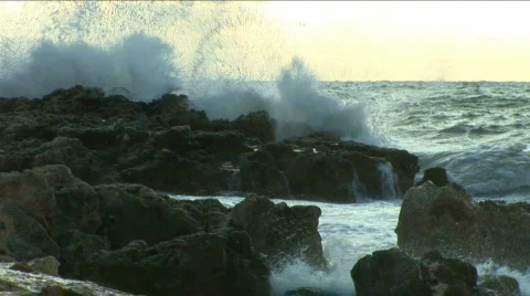 Strong wind breaks waves about coast stones Video stock 483600
