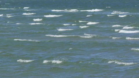 Strong wind creating whitecaps on the ocean surface Video stock 343853746