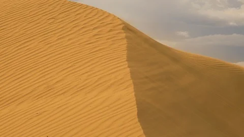Strong wind in the desert. Sand blows from the dunes Stock Footage 123770856